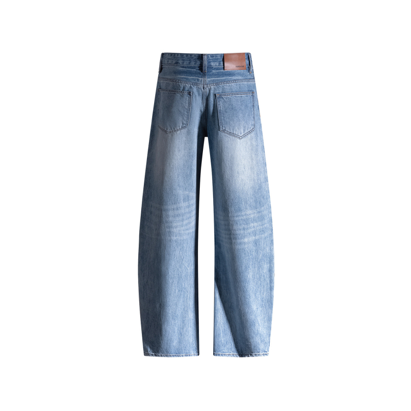 Traperice s krojem skimitar, široke nogavice, niski struk, izprani denim, velur detalj, 70–80% pamuka