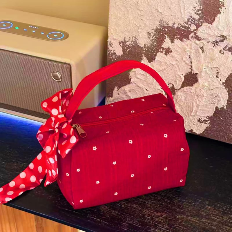 Prenosna kozmetička torbica s uzorkom mašne, tekstilni vanjski dio, podstava od poliester, periva