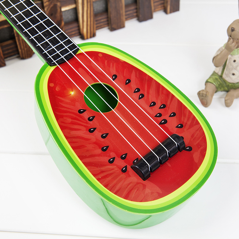 Dječja igračka gitara u obliku voća, mini ukulele; plastični okvir; marka Fag Bear; kategorija: Gitara/Bass; 3C: Druge igračke do 14 godina; dob 0–14