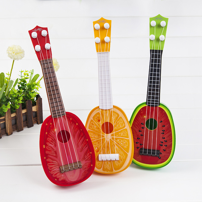 Dječja igračka gitara u obliku voća, mini ukulele; plastični okvir; marka Fag Bear; kategorija: Gitara/Bass; 3C: Druge igračke do 14 godina; dob 0–14