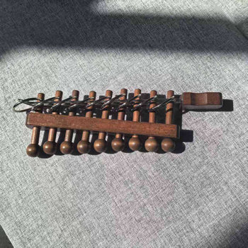 Kilenc gyűrűs fa puzzle a türelem gyakorlásához — Kategória: Kilenc gyűrű; Csomagolás: átlátszó blister; Testreszabás: OEM logó