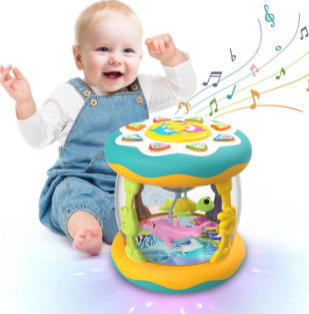 Qu'an fort gyerekeknek készült kézi dob, óceán témával, fényekkel és zenével; műanyag kivitel; 4–6 éveseknek; színes dobozos csomagolás