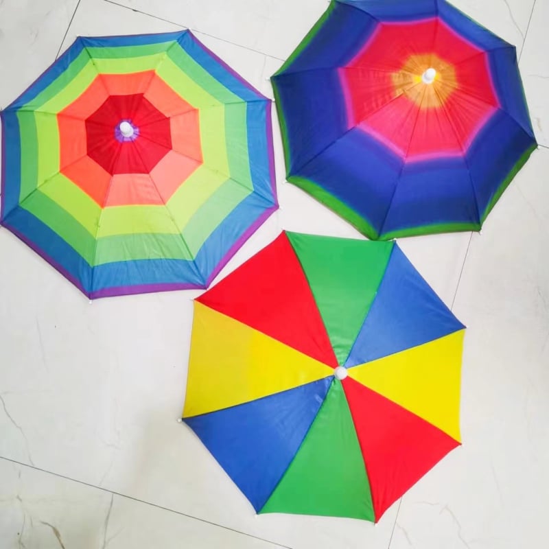 Pălărie-umbrelă cu curea reglabilă, ușoară, cadru din oțel cu 8 brațe, tijă centrală și mâner din plastic, țesătură poliester 170T, deschidere manuală