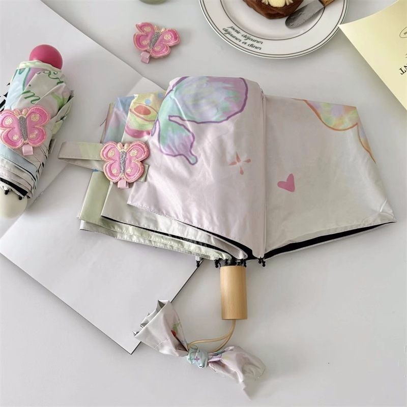 Összecsukható napernyő női használatra, tavaszi pillangó dizájn, hordozható (24 bordás szerkezet; ötvözet váza és bordák; tömör fa fogantyú; 210T vinil bevonatú anyag; UPF >50)