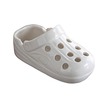 Scrumiere ceramică în formă de papuc, cu logo imprimat; Brand Mu nanshan; Origine Dehua; Ambalaj: 20 buc.; Material: ceramic.