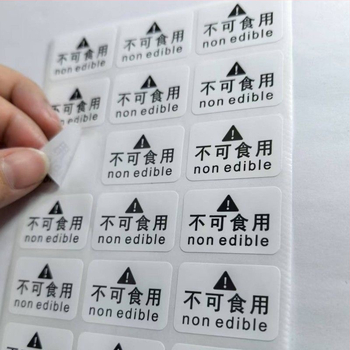 Inštruktážna nálepka s varovaním pre nejedlé výrobky | Model J2 | Materiály: kraftový papier, krehký papier, PVC samolepiaci, meďová doska samolepiaca | 50 nálepiek na stránku