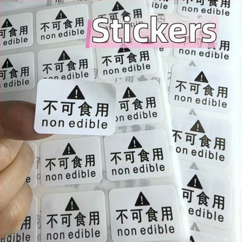 Inštruktážna nálepka s varovaním pre nejedlé výrobky | Model J2 | Materiály: kraftový papier, krehký papier, PVC samolepiaci, meďová doska samolepiaca | 50 nálepiek na stránku