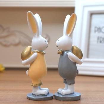 Ζεύγος διακοσμητικών Πάσχα από ρητίνη, λαγουδάκια με χρυσά αυγά — cartoon στυλ, μάρκα Winning