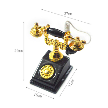 Metalni telefon kao ukras za kućicu za lutke, retro nostalgični dizajn, mini dekorativni model.