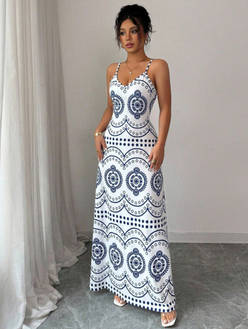 Elegantna duga haljina na tanke remenčiće s floralnim printom od Milk Silk materijala, silueta kišobran suknja, struk: srednji (Materijal: Milk Silk; Uzorak: Cvjetni; Duljina: Duga; Tip haljine: Kišobran suknja; Struk: Srednji)