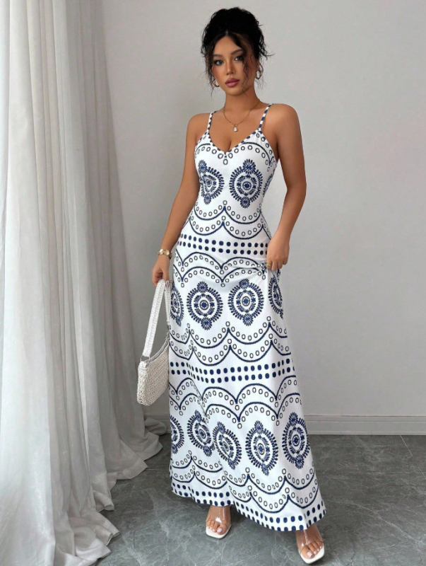 Elegantna duga haljina na tanke remenčiće s floralnim printom od Milk Silk materijala, silueta kišobran suknja, struk: srednji (Materijal: Milk Silk; Uzorak: Cvjetni; Duljina: Duga; Tip haljine: Kišobran suknja; Struk: Srednji)
