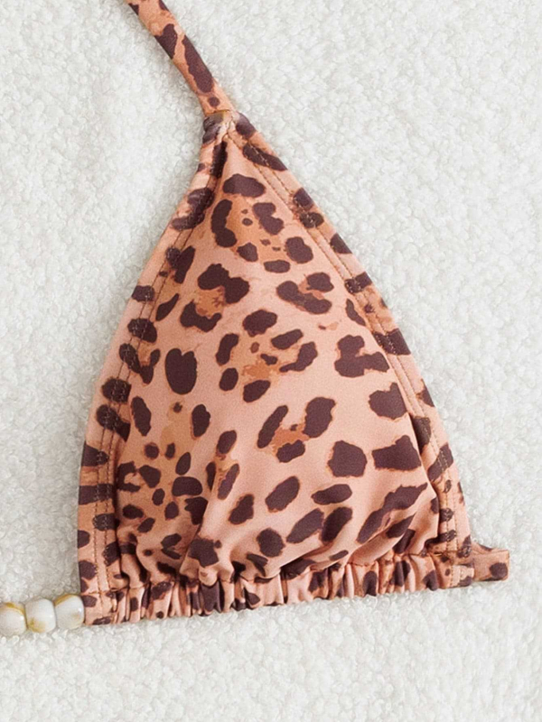 Trokomponentni leopard print bikini set: trokutasti gornji dio s umetkom, prozirna duga suknja, materijal poliester/elastan 82/18