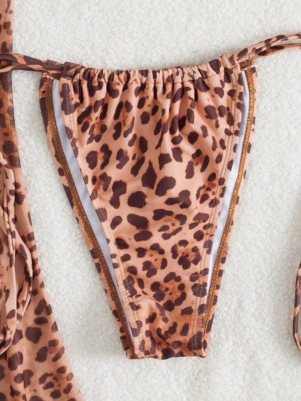 Trokomponentni leopard print bikini set: trokutasti gornji dio s umetkom, prozirna duga suknja, materijal poliester/elastan 82/18