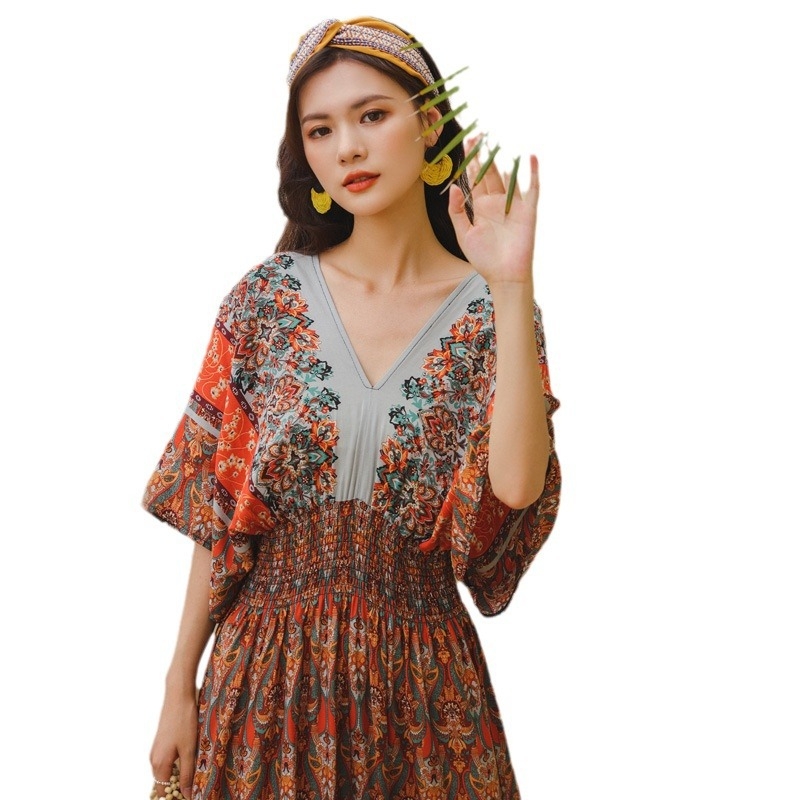 Középhosszú A-vonalú boho strandruha, nyomtatott poliészter anyagból, kerek nyakú, ujjatlan