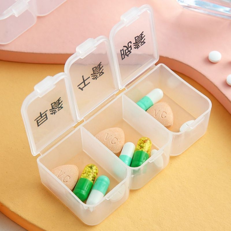 Kutija za tablete — Mini prijenosni organizator za tri dnevna obroka s podsjetnikom na uzimanje lijekova; japanski stil, mrežasti uzorak, metalno-plastična konstrukcija, kapacitet 18 L.
