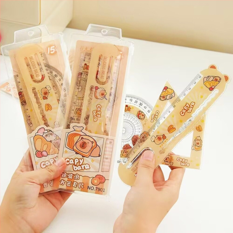 Sada štyroch plastových pravítok‑záložiek pre knihy – kapibara téma, viaceré funkcie, model 7901, čistá hmotnosť približne 50,6 g