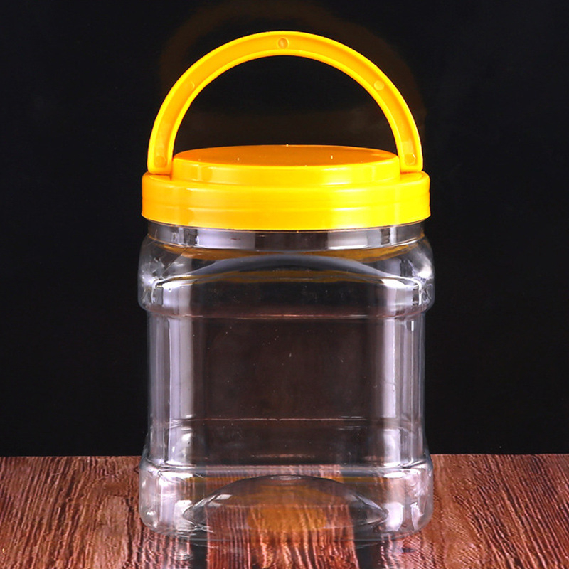 Kvadratni PET spremnik za med s ručkom, čvrst plastični kućište, zatvorena ambalaža