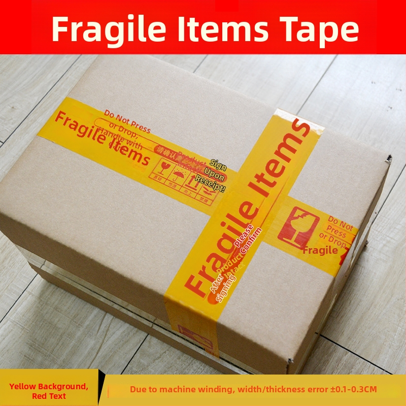 Lenta za pakiranje krhkih artikala uz upozorenje, BOPP film osnove, hidrokloloidno ljepilo, debljina 52 μm, mogućnost rezanja alatom za rezanje, namijenjena zatvaranju i pakiranju