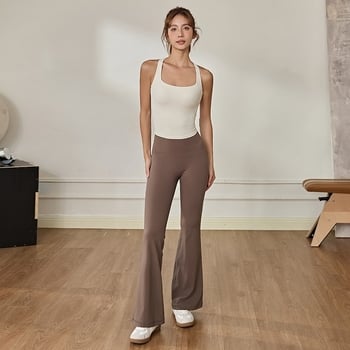 Ženski yoga top s križnim leđima i ugrađenim košaricama — odvodi vlagu, prozračan, brzo suši, visoka elastičnost; materijal najlon 80% / spandeks 20%; kratka, uska kroj