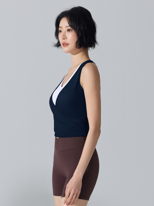 Ženski sportski top bez rukava s ugrađenim cupom, brzo se suši, prozračan materijal, lažni dvodijelni dizajn, duljina do trbuha, Lyocell-Spandex smjesa