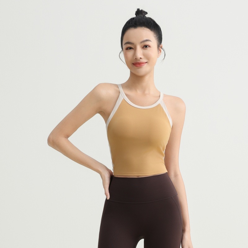 Αθλητικό γιλέκο με ενσωματωμένα κύπελλα, σχέδιο με χρωματικό μπλοκ, σταυρωτό πίσω, υποστήριξη απορρόφησης κραδασμών και απομάκρυνση ιδρώτα, ύφασμα νάιλον/elastan (75/25), κατάλληλο για το τρέξιμο και την προπόνηση.