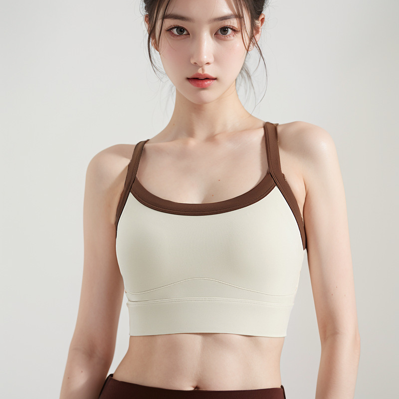Bezšivni ženski sportski top bez rukava s ugrađenim oblikovanim čašicama, brzo se suši, materijal: 75% najlon, 25% spandex, potpuno punjenje čašica, srednji oblik čašica, fiksni dvostruki naramenici