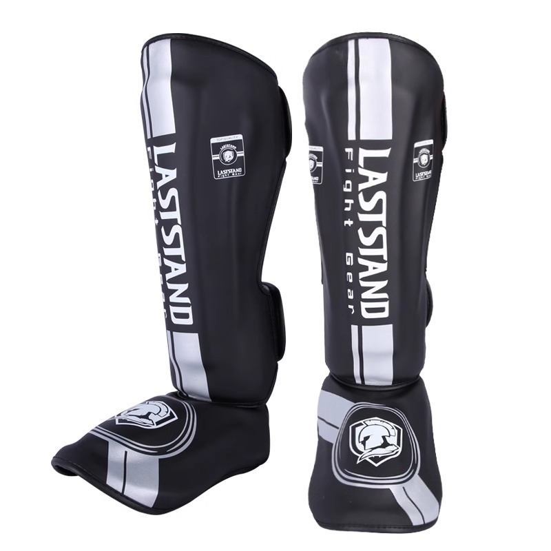 Muay Thai štitnik za potkoljenicu PU vertikalnog dizajna, model fangs leggings, težina 0.5