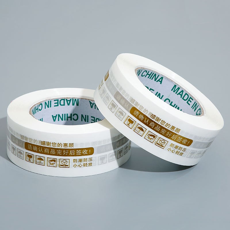 Лента за запечатване на кутии с предупредителен текст, BOPP филм, 60 μm, лепило на водна основа, разкъсване с инструмент, 0–60°C, подходяща за електронна търговия и складово опаковане