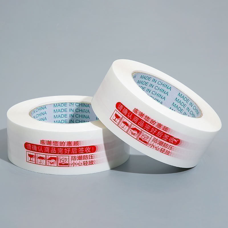 Лента за запечатване на кутии с предупредителен текст, BOPP филм, 60 μm, лепило на водна основа, разкъсване с инструмент, 0–60°C, подходяща за електронна търговия и складово опаковане