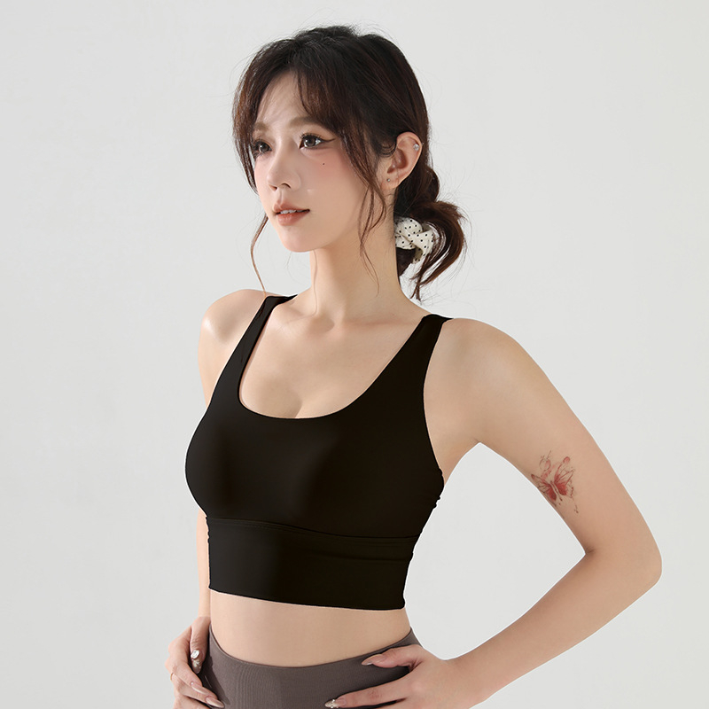 Ženski fitness grudnjak, jedinstveni sportski top s visokom podrškom, pune košarice s srednjim oblikovanjem, materijal najlon/spandeks, čvrste dvostruke naramenice, s umetnutim jastučićima.