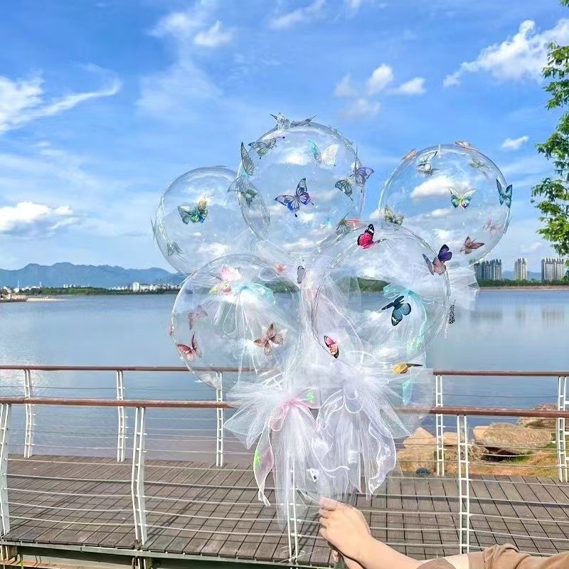 Latex balon, valovit balon, okruglog oblika, motiv leptira s vrpcom, bez logotipa