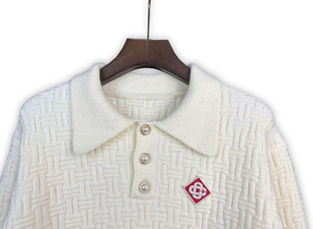 Pulover s polo ovratnikom, jacquard pleteni, ležernog kroja, dugi rukavi (71–75% vuna; jacquard pletene; polo ovratnik; srednja duljina; prozračan materijal)