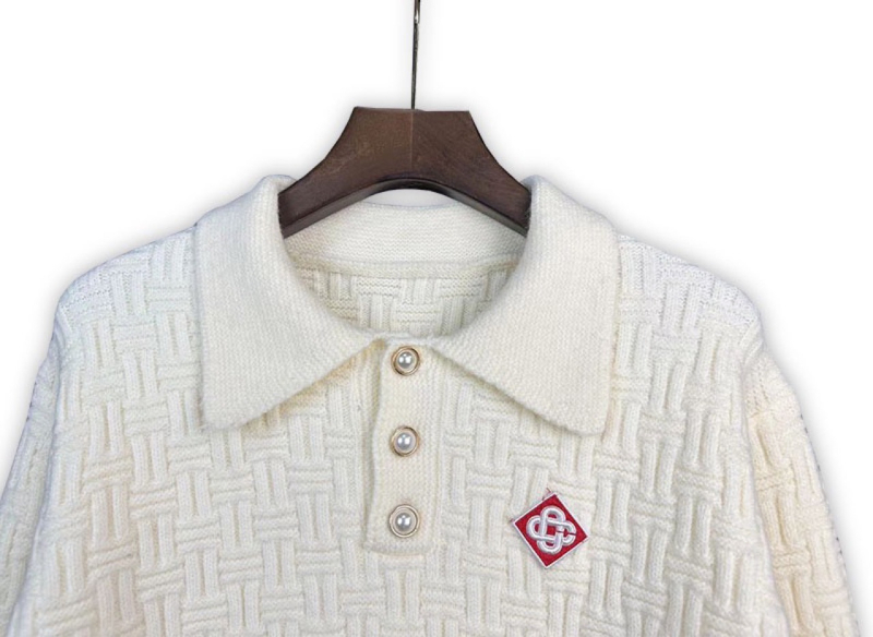 Pulover s polo ovratnikom, jacquard pleteni, ležernog kroja, dugi rukavi (71–75% vuna; jacquard pletene; polo ovratnik; srednja duljina; prozračan materijal)