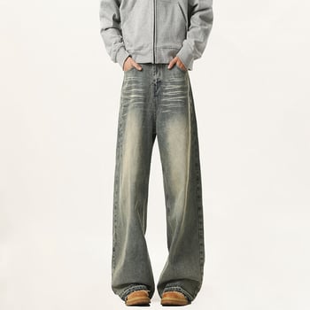 Jeans od denima s distres efektom, ravni kroj s širokim nogavicama, srednji porast struka, zip, 60% pamuka