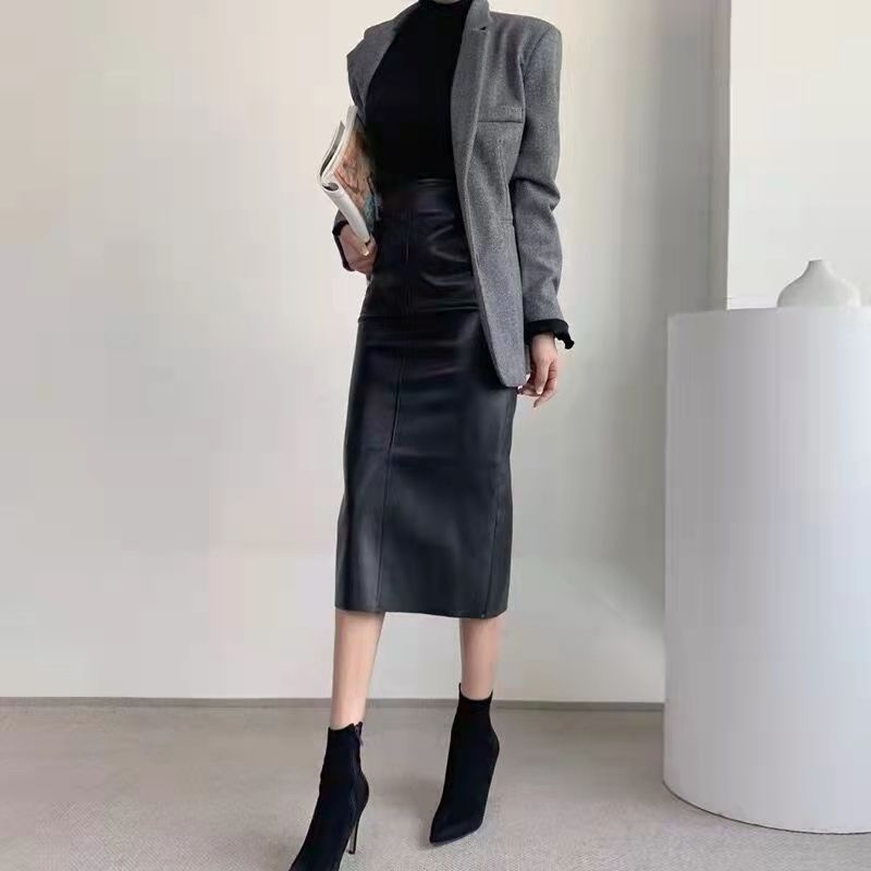 Suknja s stražnjim prorezom, visokim strukom, srednje duljine, gradski elegantan stil, zatvarač i šivanje