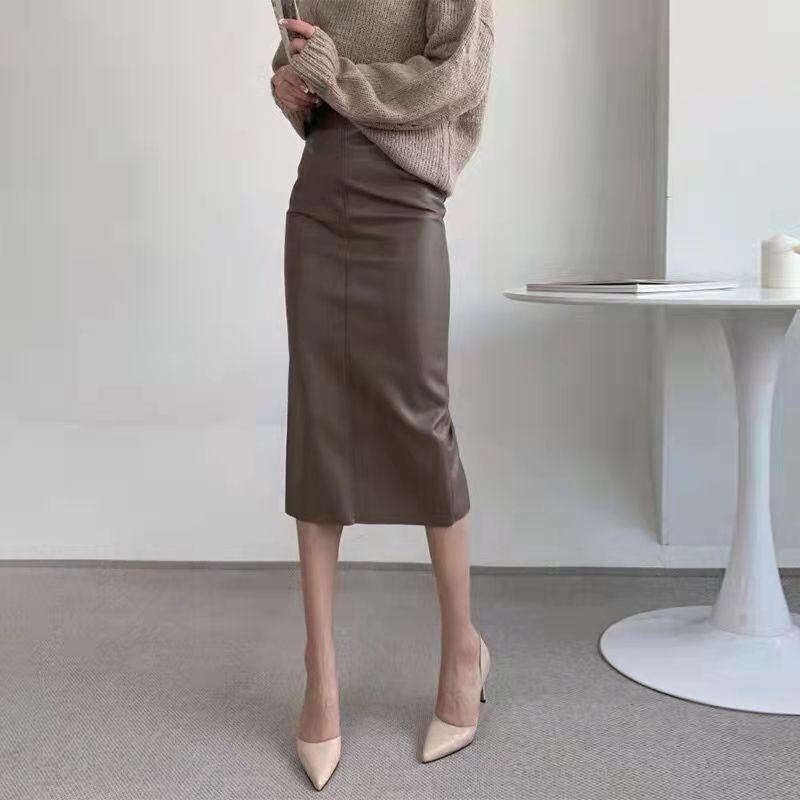 Suknja s stražnjim prorezom, visokim strukom, srednje duljine, gradski elegantan stil, zatvarač i šivanje