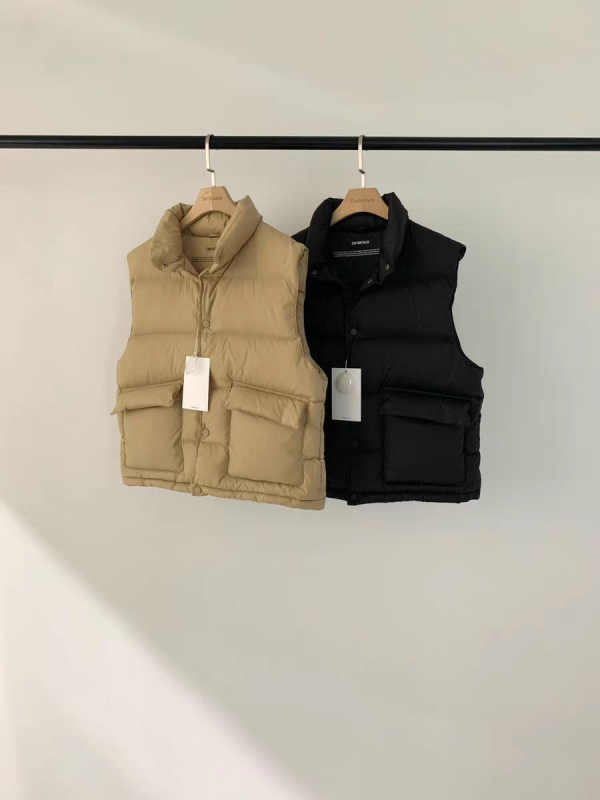 Ženski down vest, 86–90% patka perja, najlon tkanina, stojeći ovratnik, jednostruko kopčanje, duljina 50–65 cm