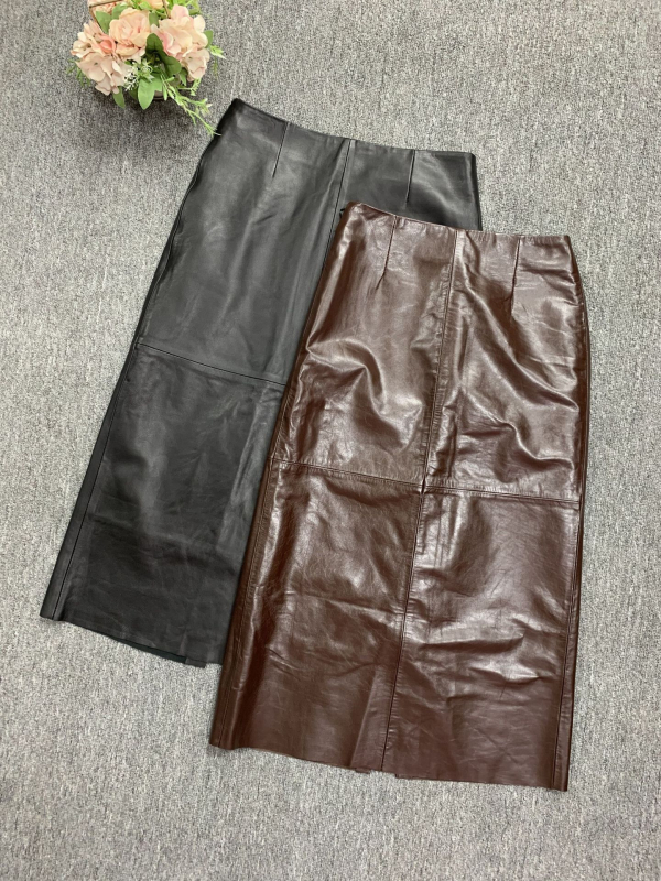 Suknja od kozje kože, visok pojas, srednja duljina, ravni kroj s otvorom, vintage uredski stil, jesen 2024