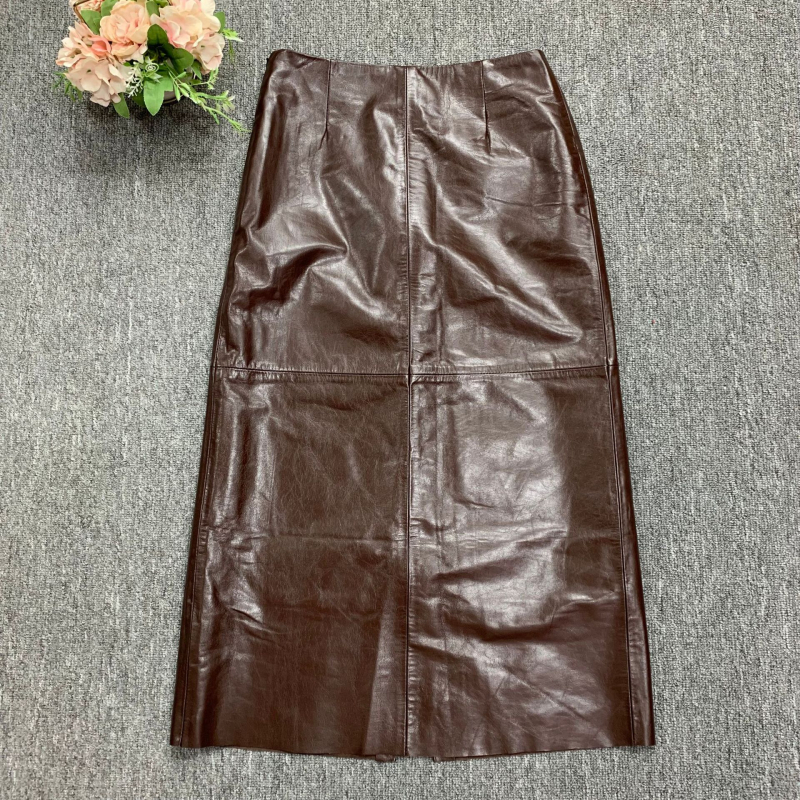 Suknja od kozje kože, visok pojas, srednja duljina, ravni kroj s otvorom, vintage uredski stil, jesen 2024