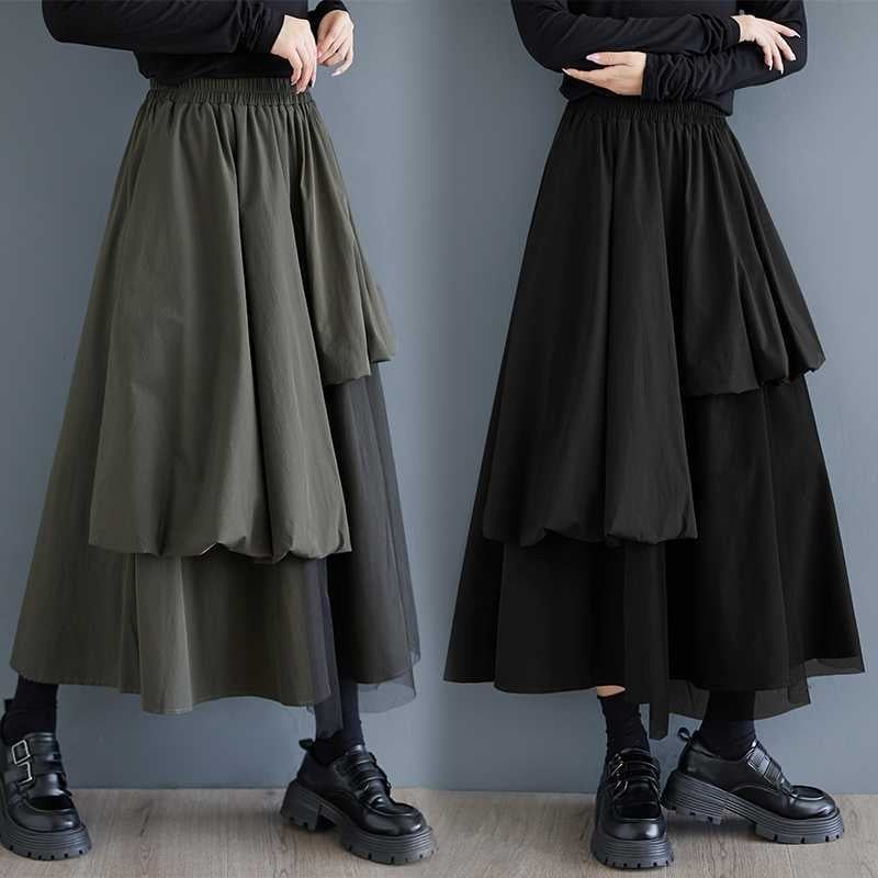 Mrežasta suknja s nepravilnim krojem, srednja duljina, uredski stil