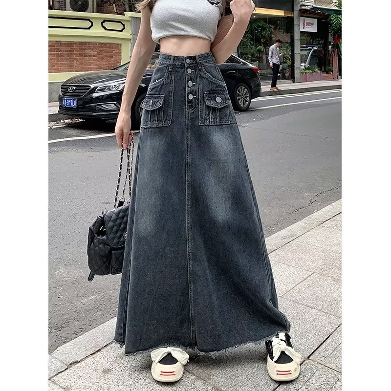 Denim suknja visokog struka i sirov rub, detalji kolage šivanja, duga silueta, mikro-elastičan materijal s 30–50% poliestera