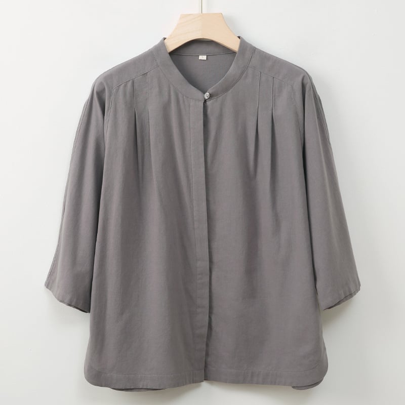 Ženska košulja: pamuk; imitacija ramije, sand-washed; stojeći ovratnik; rukav 3/4; kopčanje na jedan red gumba