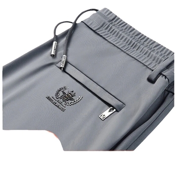 Muške sportske hlače za svakodnevnu upotrebu, s visokim elastičnim pojasom, ravnog kroja, duge, materijal: poliester‑mješavina (90% poliester)