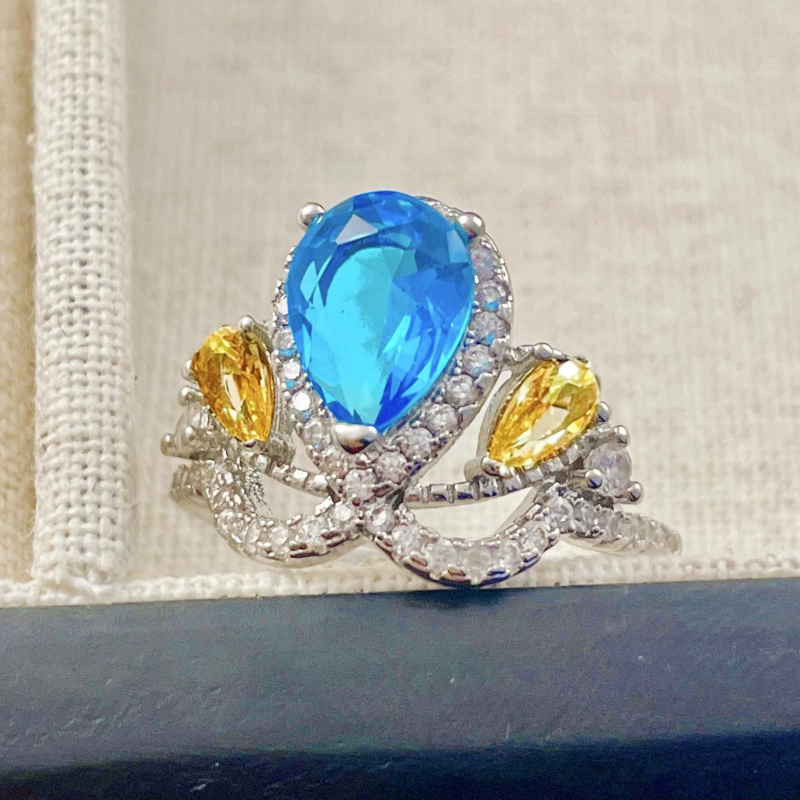 Bakreni prsten, kapljasti oblik, postavljanje krune, London blue topaz, dijamantno brušenje
