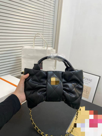 Torba od prave kože u obliku mašne, s džepom na zip, magnetsko zatvaranje, platnena podstava