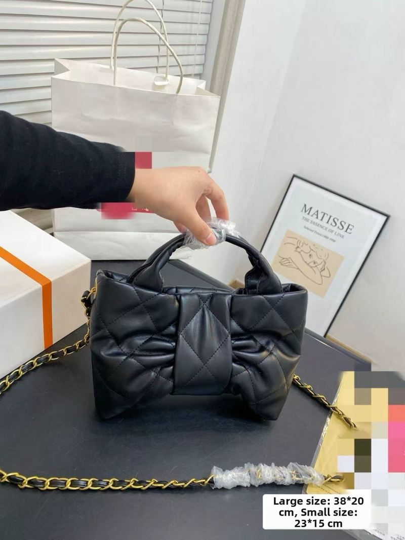 Torba od prave kože u obliku mašne, s džepom na zip, magnetsko zatvaranje, platnena podstava