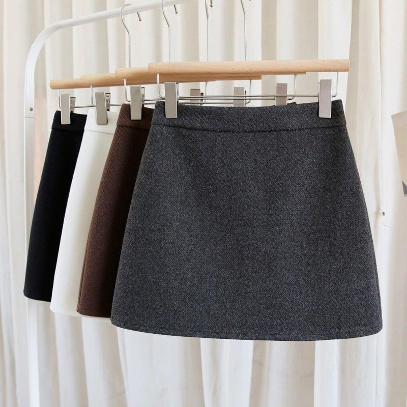 Pola s visokim strukom i A-krojem, pamuk-poliester smjesa, zatvarač, mikroelastičnost, gradski stil