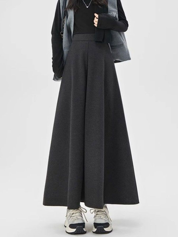 Suknja visokog struka u A-silueti, srednje duljine, geometrijski uzorak, drapirana topla tkanina, uredski stil, 30–50% regeneriranih celuloznih vlakana