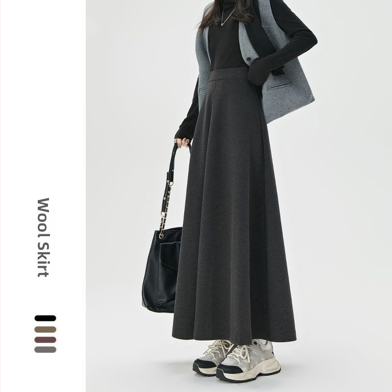 Suknja visokog struka u A-silueti, srednje duljine, geometrijski uzorak, drapirana topla tkanina, uredski stil, 30–50% regeneriranih celuloznih vlakana