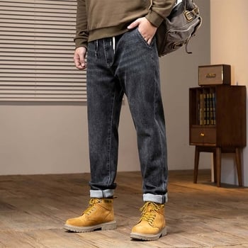 Muške traperice od denima, isprane, široki kroj, srednje visoki pojas, gusta tkanina, elastičnost